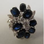 A white gold dress ring, set with sapphires and diamonds  stamped 14k/585