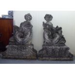 A pair of composition stone, two part Four Seasons terrace ornaments, each featuring a cherubic