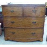 A mid 19thC mahogany bow front dressing chest with two short drawers, over two long drawers,