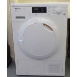 A Miele TI 7kg tumble dryer, in white casing  33"h  23"w