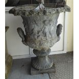 A late 19thC lead, twin handled, pedestal terrace vase, decorated with frieze figures  21"h  19"w