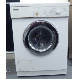 A Miele Nouetonic W685 washing machine, in white casing  33"h 23"w