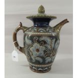 An early 20thC Royal Doulton Lambeth stoneware lidded jug, decorated in tubeline with flora and