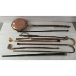 A mixed lot: to include a late Victorian warming pan; walking aids; and a replica sword