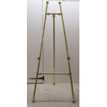 A modern tubular lacquered brass easel  59"h