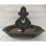 A late 19thC cast iron boot scraper  8"h  13"w