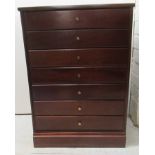 A modern mahogany, seven drawer music cabinet, on a plinth  27"h  19"w