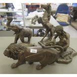 Cast metal animals and figures: to include a prowling lion  7.5"h