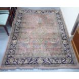 A part silk woven pictorial rug, decorated with birds amongst trees, flora and foliage, on a multi-