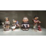 Four Goebel and similar china ornaments, viz. three Bavarian children, in various poses  4"h; and