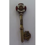 A silver and enamelled key, presented to one Rev. Charles H Kelly, Leeds parish in 1907