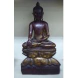 A late 19thC Burmese painted and gilded softwood seated Buddha  20.5"h
