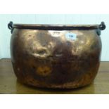 An early 19thC copper cooking pot with a wrought iron swing top handle  11"h  16"w