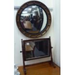 A late 19thC mahogany framed toilet mirror, pivoting on turned horns and splayed feet  16.5"h  16.