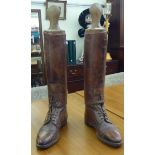 A pair of vintage mid brown leather men's high, lace up boots  approx. size 10 (19"h) with wooden