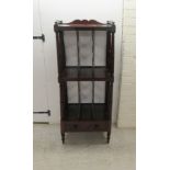 A mid 19thC mahogany three tier Canterbury, comprising a galleried shelf top, the two lower levels