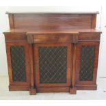 A Regency mahogany breakfront chiffonier, the low, panelled upstand back with a brass gallery, on