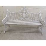 A 19thC white painted, cast iron garden bench, decorated in Gothic taste with uniform quatrefoil and