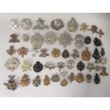 Approx. fifty British regimental cap badges and other insignia, some copies: to include The Royal