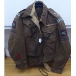 A 1943 dated British Parachute Regiment officers battledress with a lanyard and a pair of