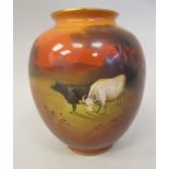 A Royal Doulton china vase of baluster form, decorated by W Hodkinson, depicting cattle in an