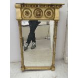 A late Regency pier glass, the bevelled plate set in a carved giltwood and gesso frame with ball