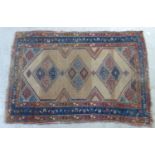 A Caucasian rug with a triple pole medallion, in a beige and blue ground  37" x 56"
