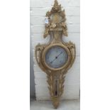A late 19thC Black Forest barometer, carved with swags, garlands and foliage  42"h