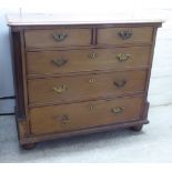 A George III mahogany dressing chest with two short/three long drawers, flanked by fluted pilasters,