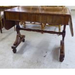 A Regency mahogany sofa table with two frieze drawers, raised on opposing lyre shaped ends  28"h