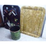Two Italian Fornasetti painted and printed steel trays  30" x 22"; and a green bin, by the same