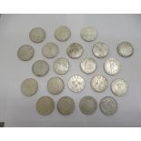 Twenty-one white metal coated replica coins