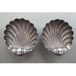 A pair of silver shell design salt cellars  Birmingham 1911