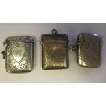 Three similar Edwardian silver traditional shape vesta cases with pendant rings, hinged caps, strike