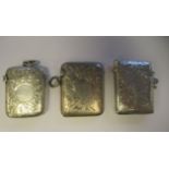 Three similar Edwardian silver traditional shape vesta cases with pendant rings, hinged caps, strike