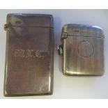 An Edwardian silver card case with a hinged cap  Chester 1904; and a silver engine turned cushion