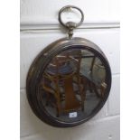 A modern cast and distressed metal mirror, fashioned as a pocket watch  23"h  17"w