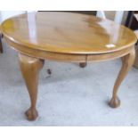 A 1930s walnut occasional table, raised on cabriole legs, talon and ball feet  18"h  29"dia