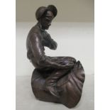 A patinated bronze sculpture, a jockey in the saddle  stamped BW  11"h