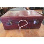 A vintage crocodile skin vanity case with brass clasps, enclosing a part fitted interior  7.5"h