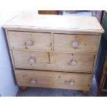 An early 20thC bleached pine dressing chest, the two short/two long drawers with bun handles, raised