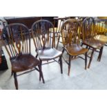 A matched set of four late Victorian beech and elm framed wheelback Windsor chairs, each with a