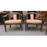 A pair of 20thC antique finished walnut framed horseshoe shaped chairs with upholstered splats and