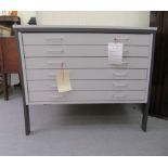 A modern grey painted laminate six drawer plan desk, raised on rectangular legs  33"h  40"w