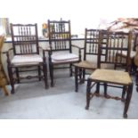 A matched set of four early 19thC ash and oak framed Lancashire spindle back dining chairs, each