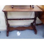 A late 19thC walnut centre table, the top raised on opposing cross design supports, platforms and