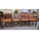 A set of eight mid 20thC satin mahogany framed and carved dining chairs with stud upholstered seats,