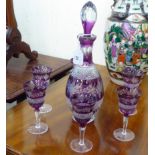 A 20thC clear and amethyst coloured glass thumb moulded and diamond pattern cut decanter; and a