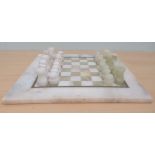 An onyx chess set, the board 14"sq