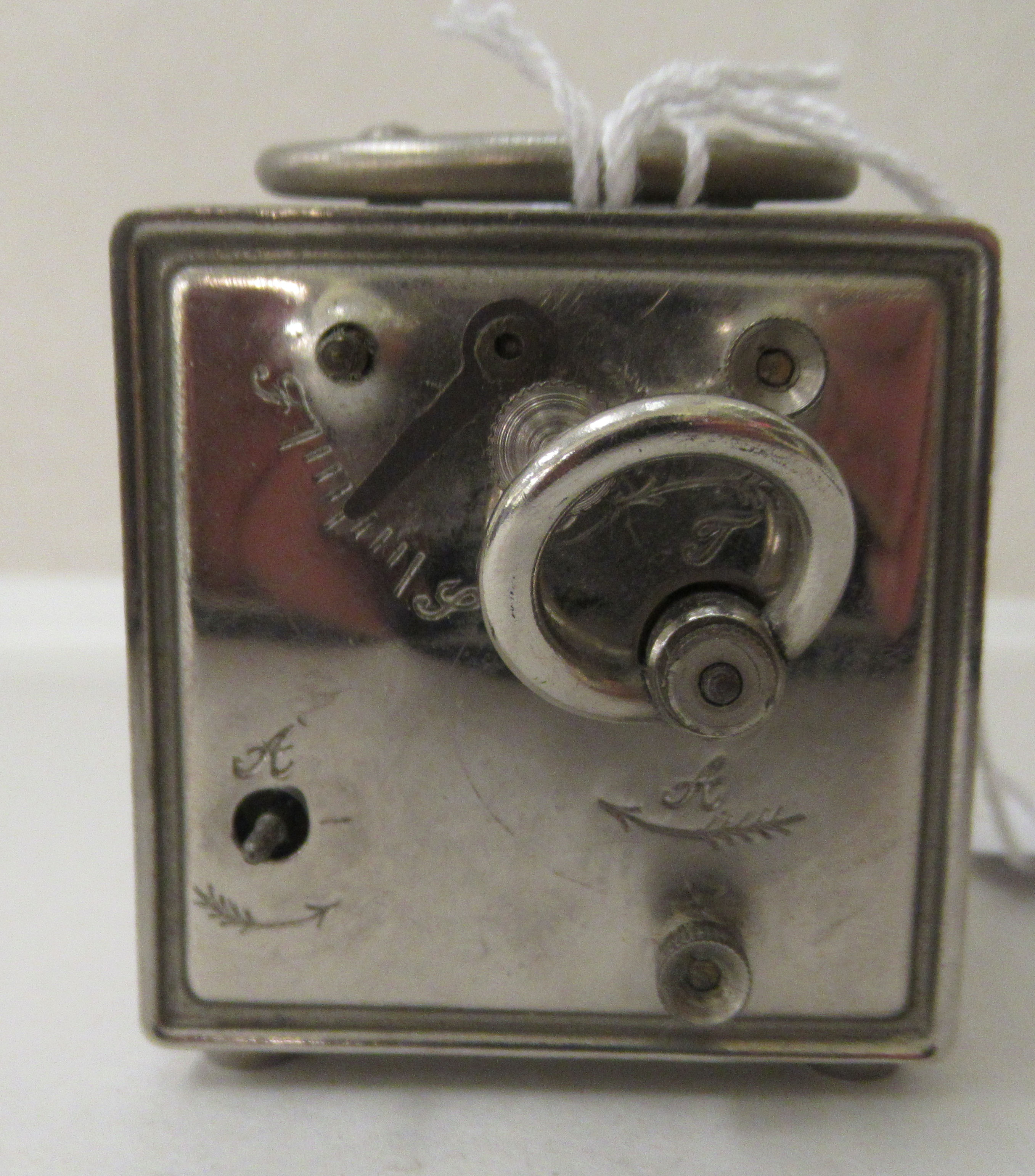 An Art Deco chromium finished cased carriage clock with an alarm; faced by an Arabic dial - Image 4 of 7